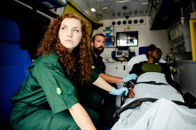 EMTs loading a man into an ambulance