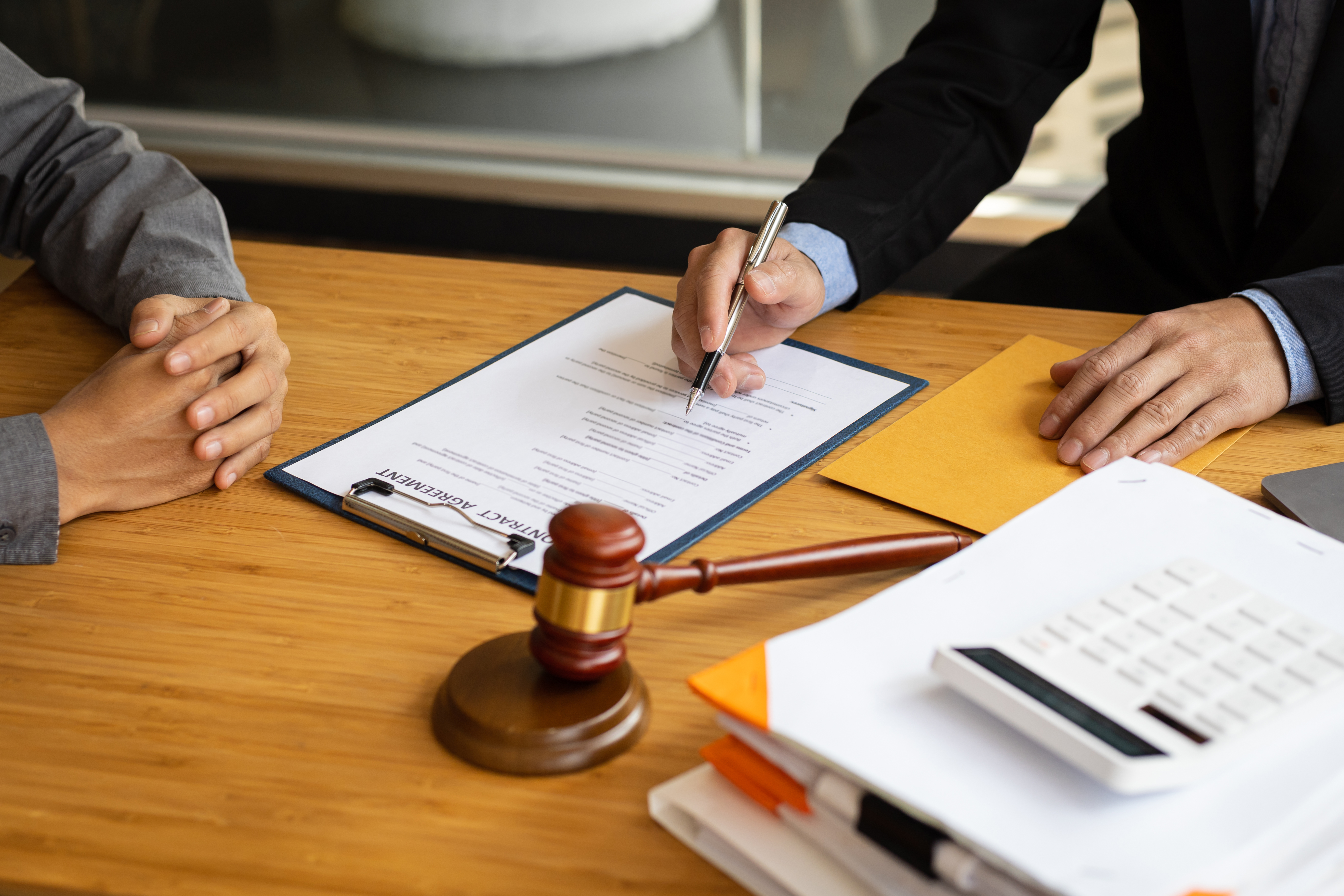 Attorney and client reviewing alimony documents during Florida divorce timing consultation