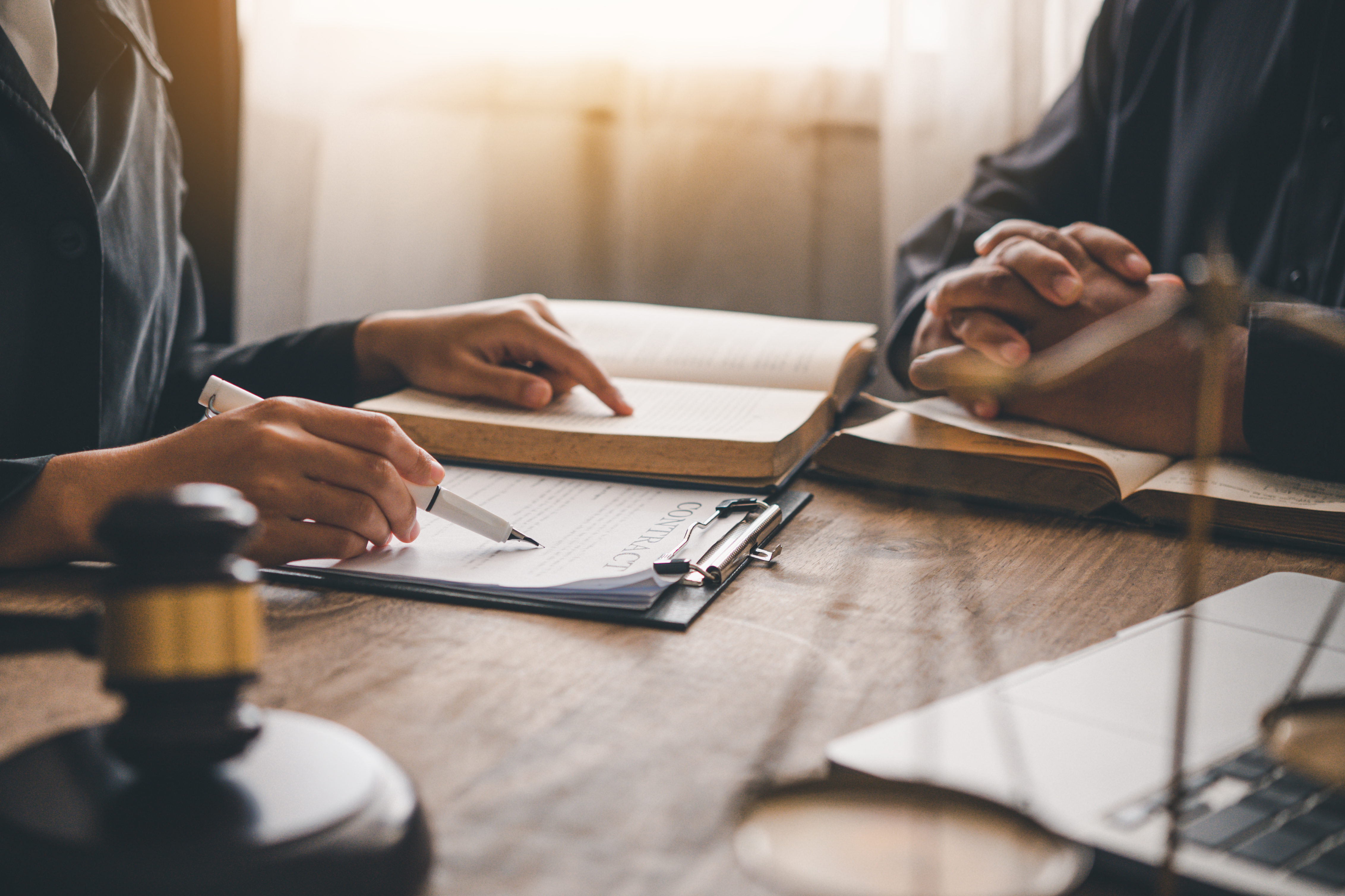Two attorneys reviewing documents related to a personal injury claim timeline in Florida