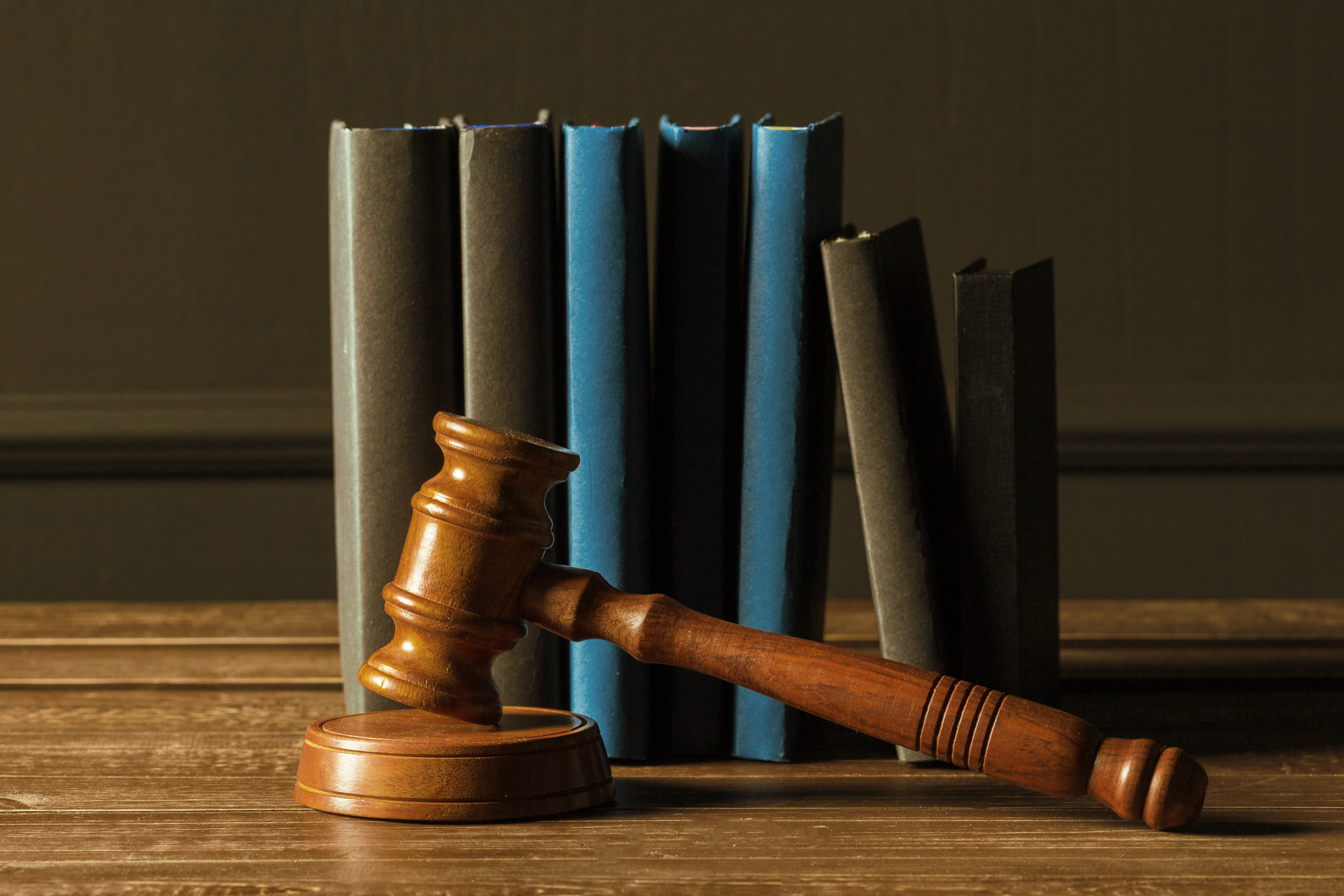 Gavel and law books on desk representing slip and fall claim mistakes in Tampa