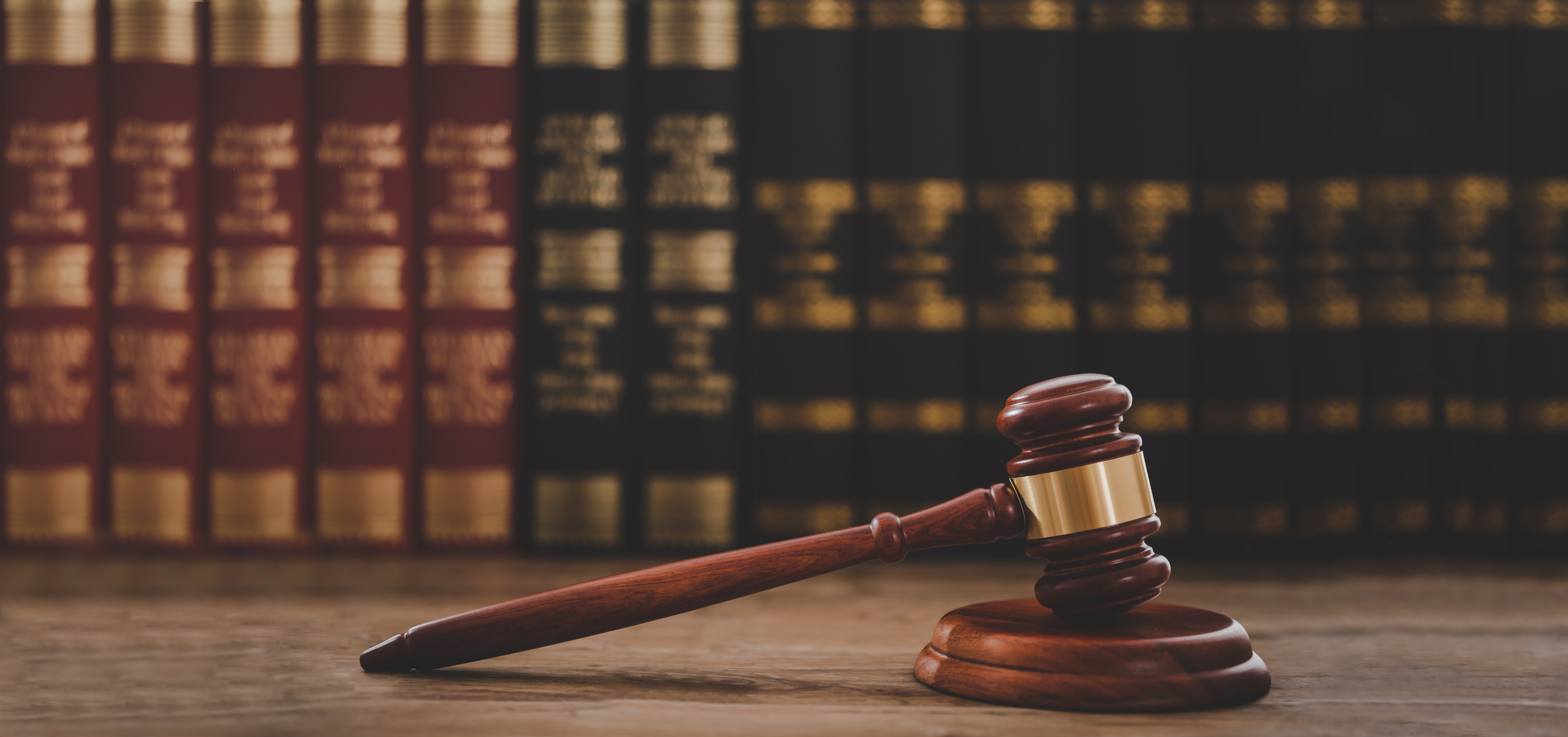 Wooden desk with gavel and law books representing when to file for divorce Florida