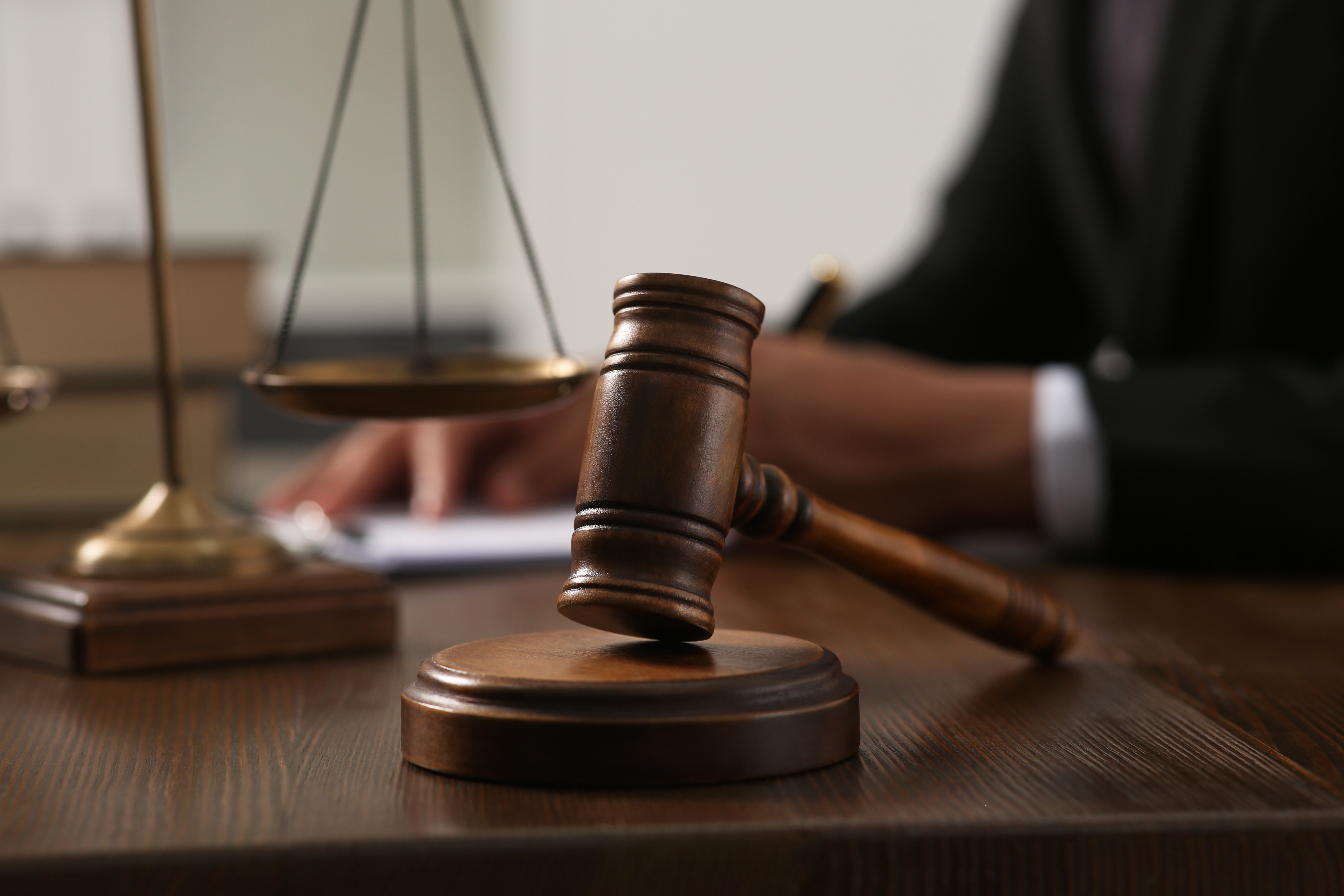 Courtroom gavel and scales of justice symbolizing how to document slip and fall claims