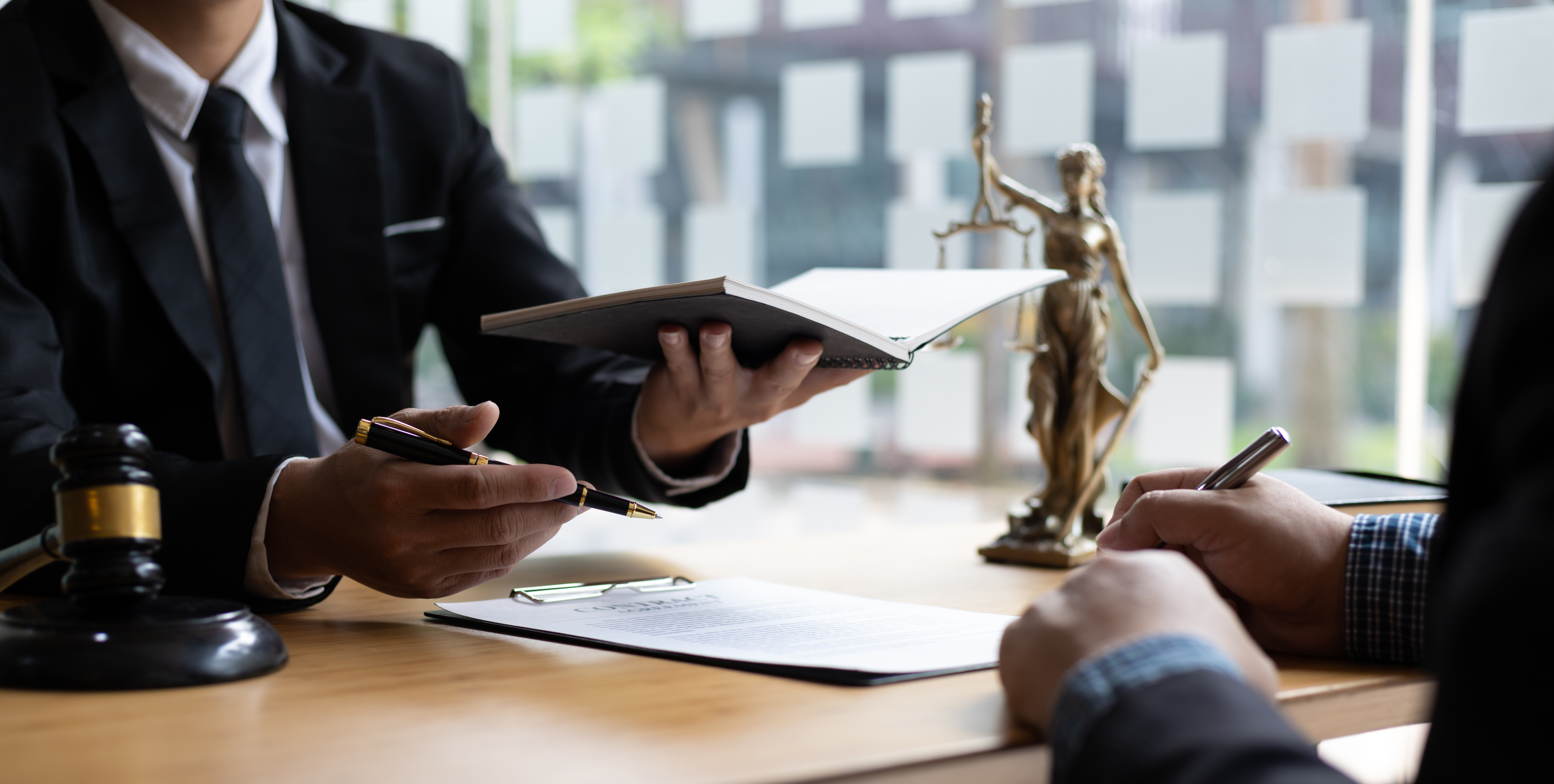 Attorneys reviewing documents to build a wrongful death claim Florida case