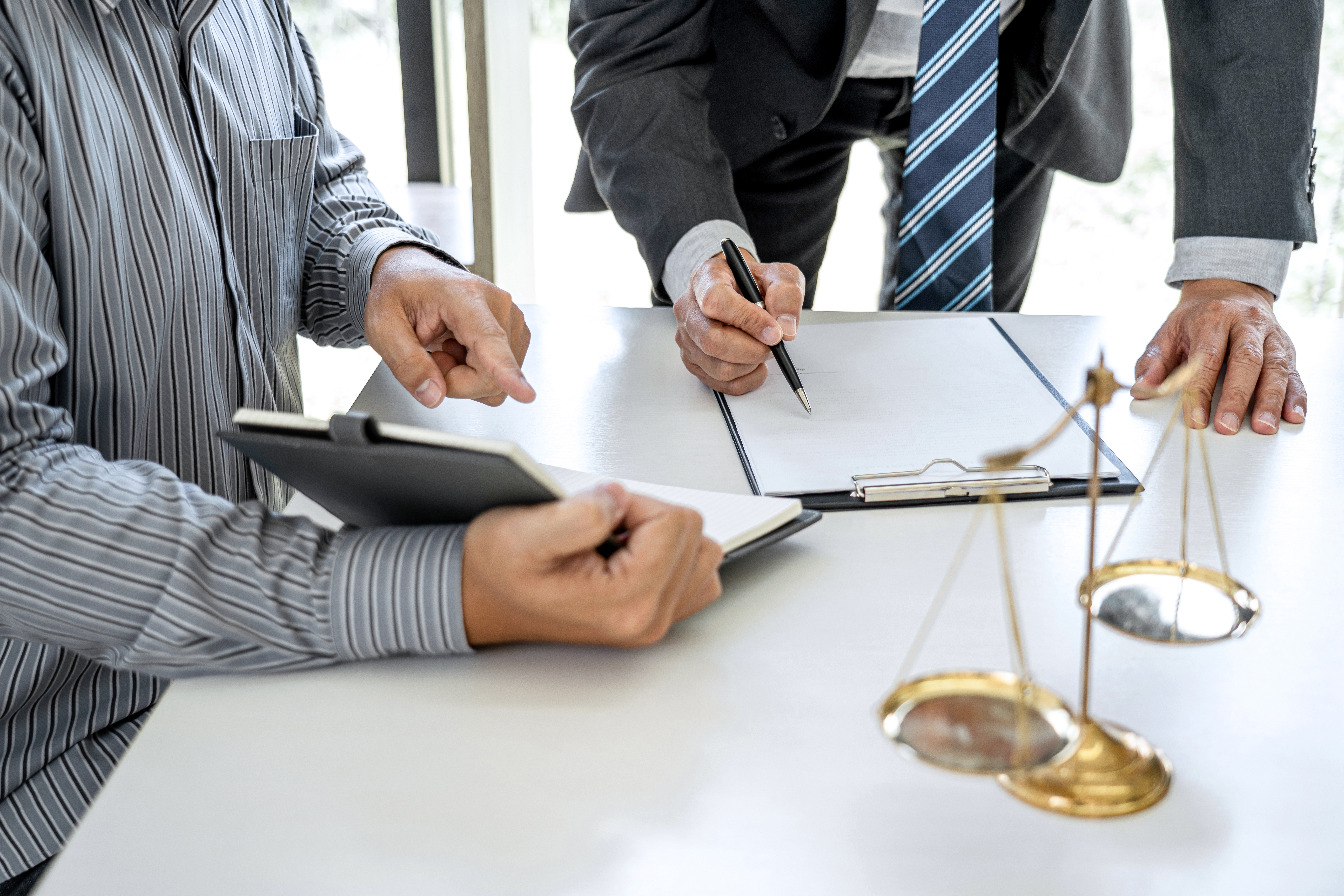 Attorneys reviewing Florida injunction documents, representing a restraining order attorney Tampa consultation